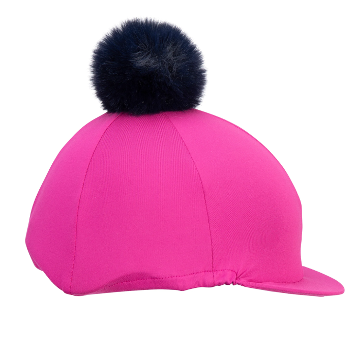 Pink riding hat with a black fur pom-pom on a white background