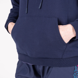 Hands in pocket of blue sweater