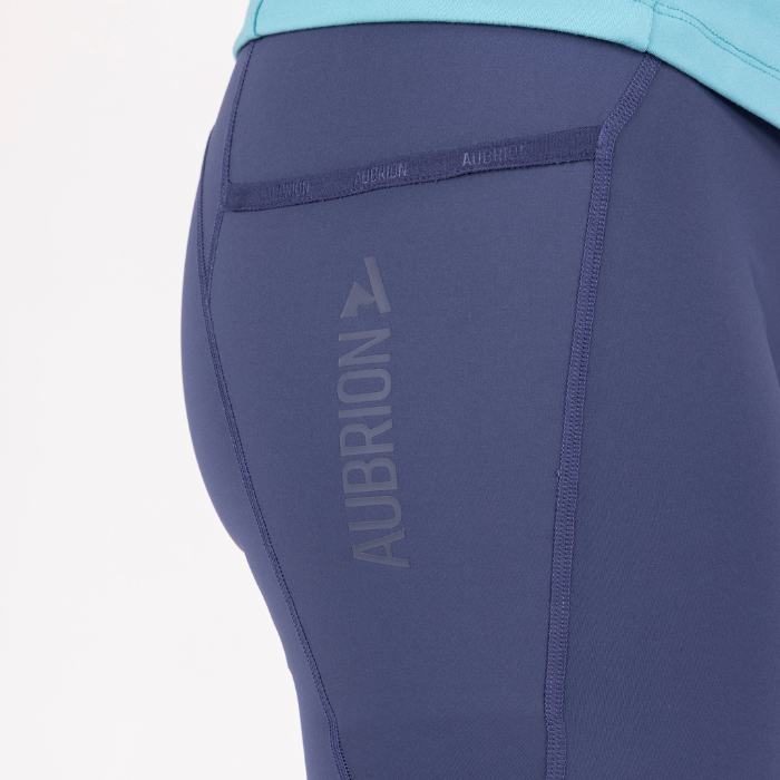Blue athletic pants with 'Aubrion' branding on a white background