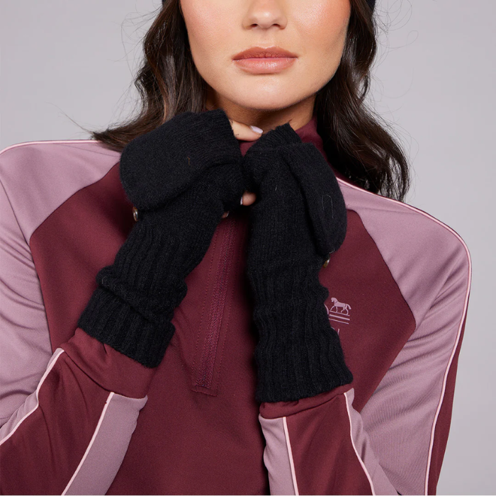 Person wearing a maroon and pink jacket with a black scarf, on a plain background