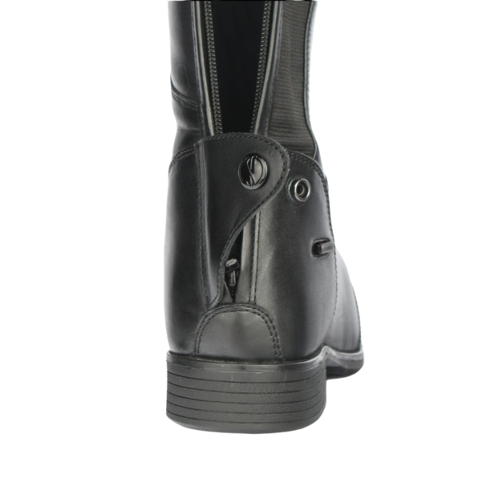 Close-up of zip detail on long riding boot on a white background
