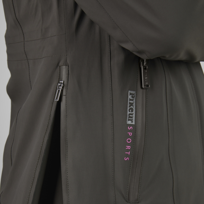 Close-up of a dark green jacket with a 'PIKEUR SPORTS' brand logo on a light grey background